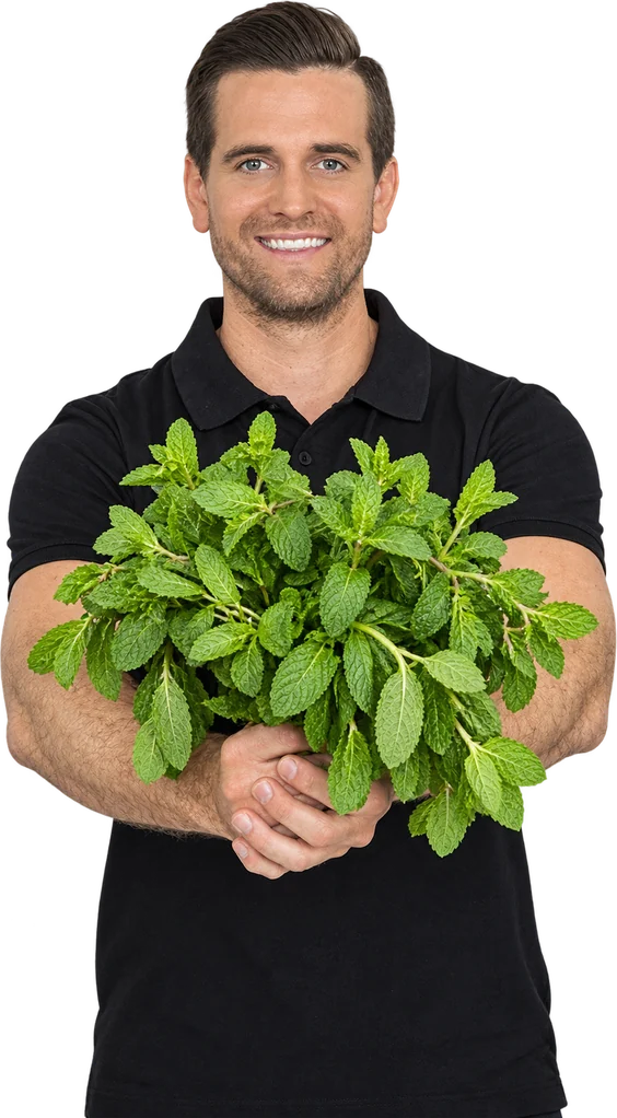 Tommy from Raw Blend holding a big bunch of fresh mint